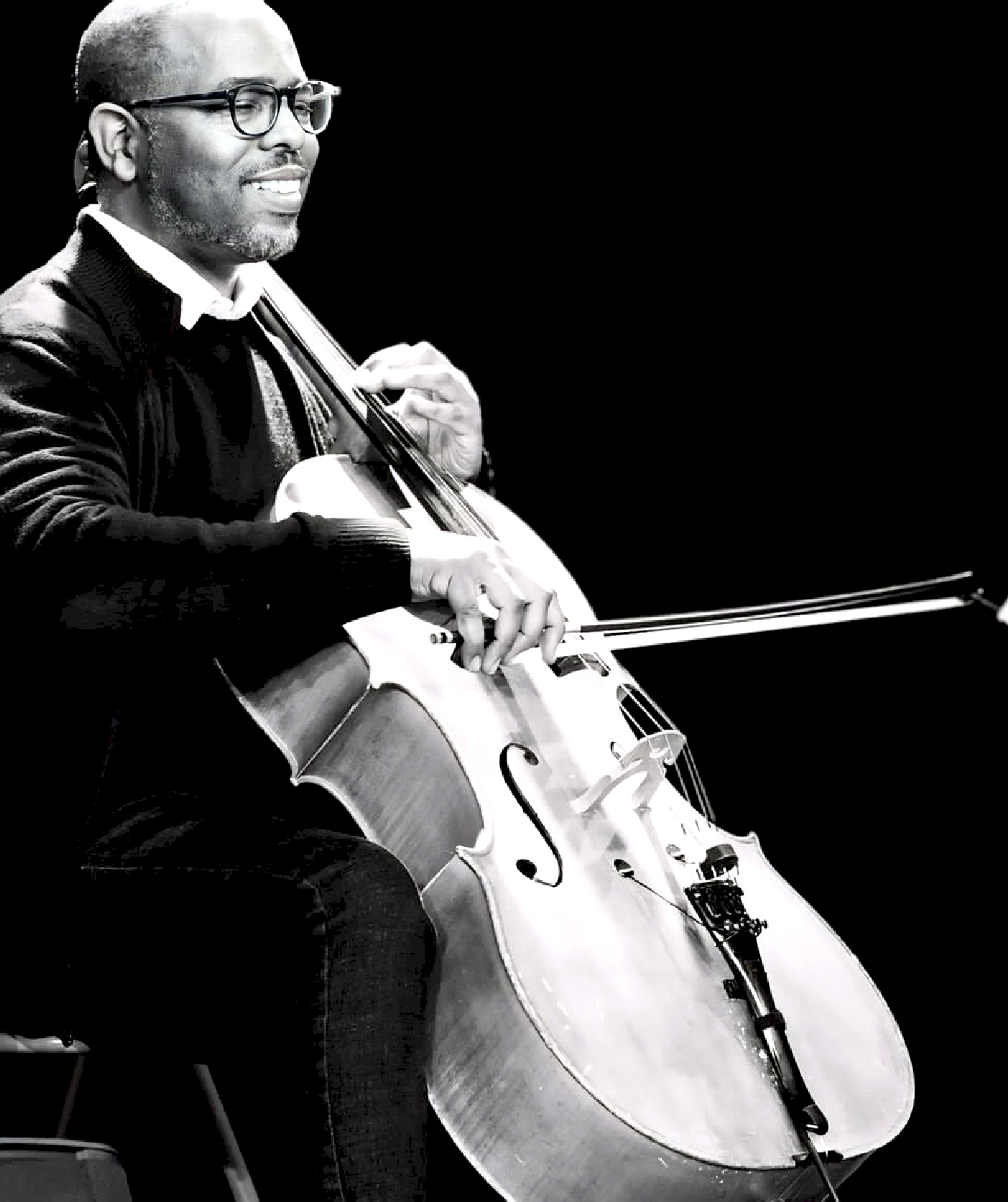 Black and white portrait of a cellist performing
