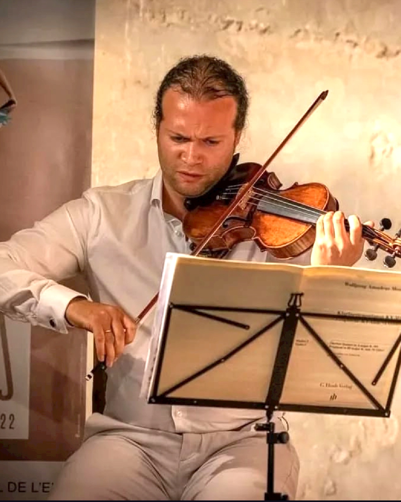 Classical violinist performing in an intimate interior