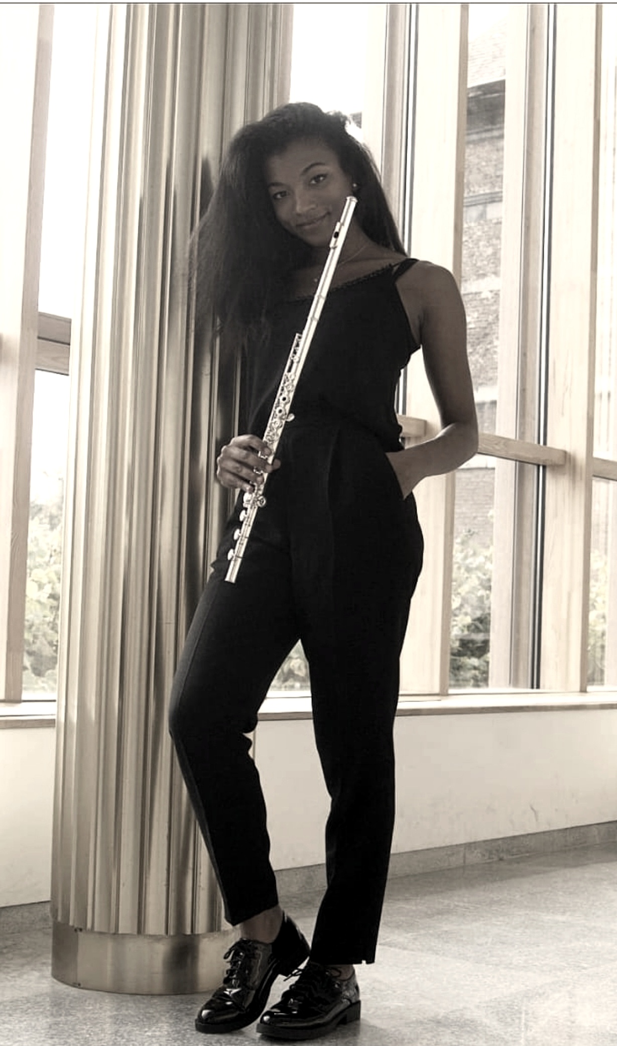 Flutist performing with an orchestra