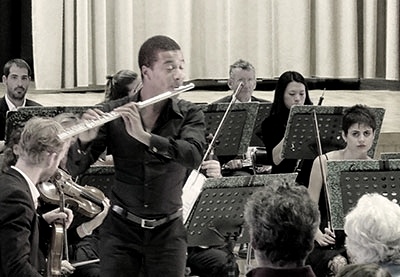 Flutist performing with a classical ensemble