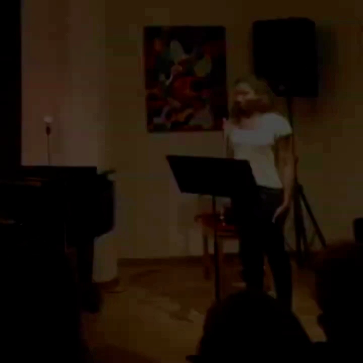 Film still of the flutist performing
