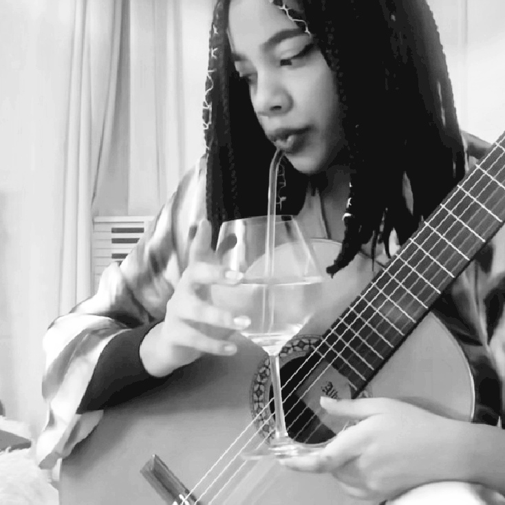 The vocalist playing guitar