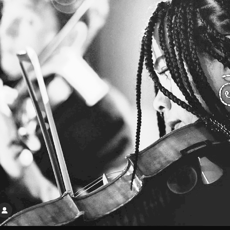 The vocalist playing violin